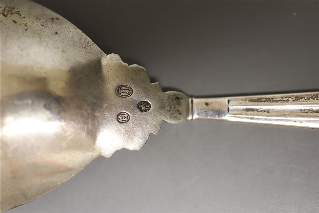 A 1920s Georg Jensen sterling Acorn pattern serving spoon, 23cm and one other Jensen spoon with horn bowl, gross 124 grams.